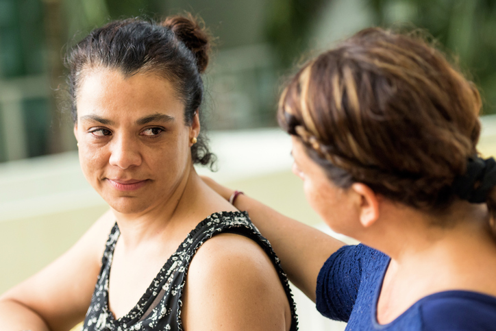 A woman being supported by a counsellor
