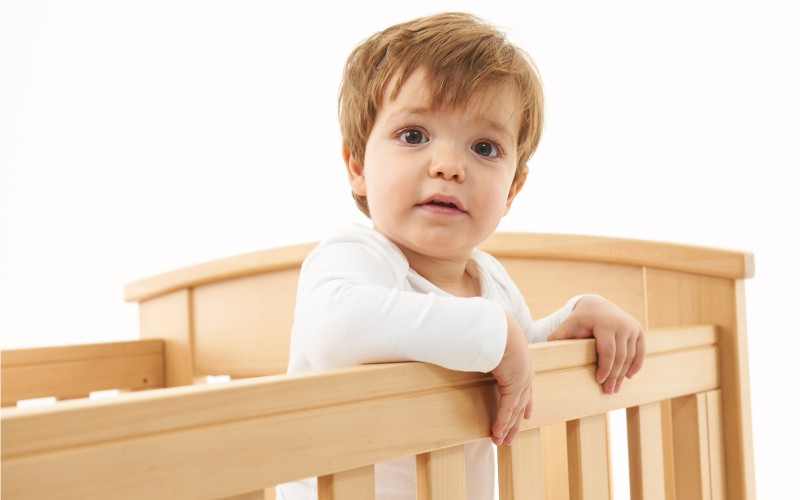 Boy in cot image