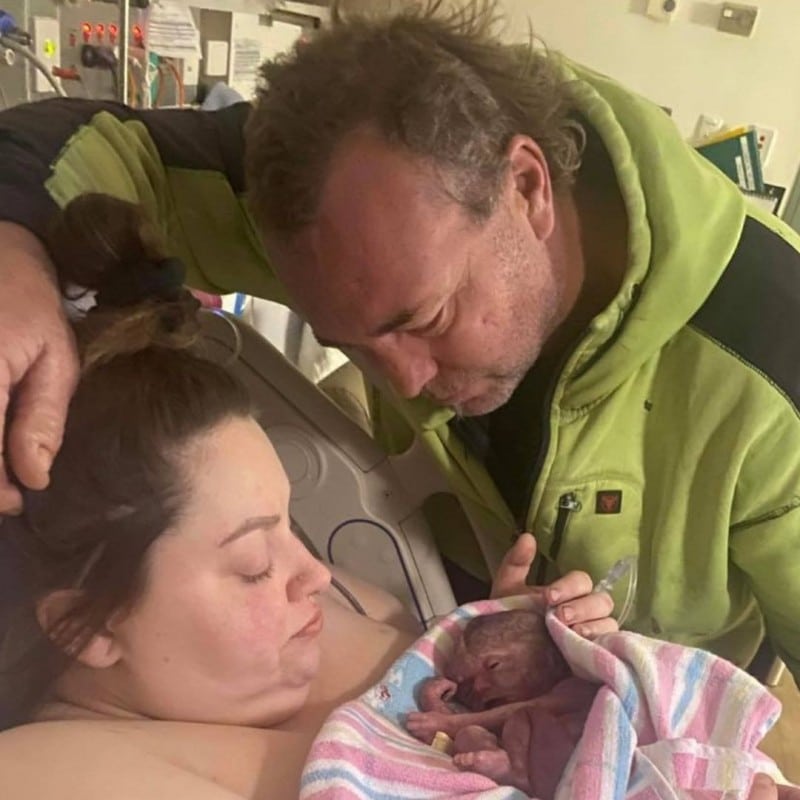 Baby_Nash Beautiful Baby Nash is wrapped in a pink and blue hospital blanket whilst his parents look on