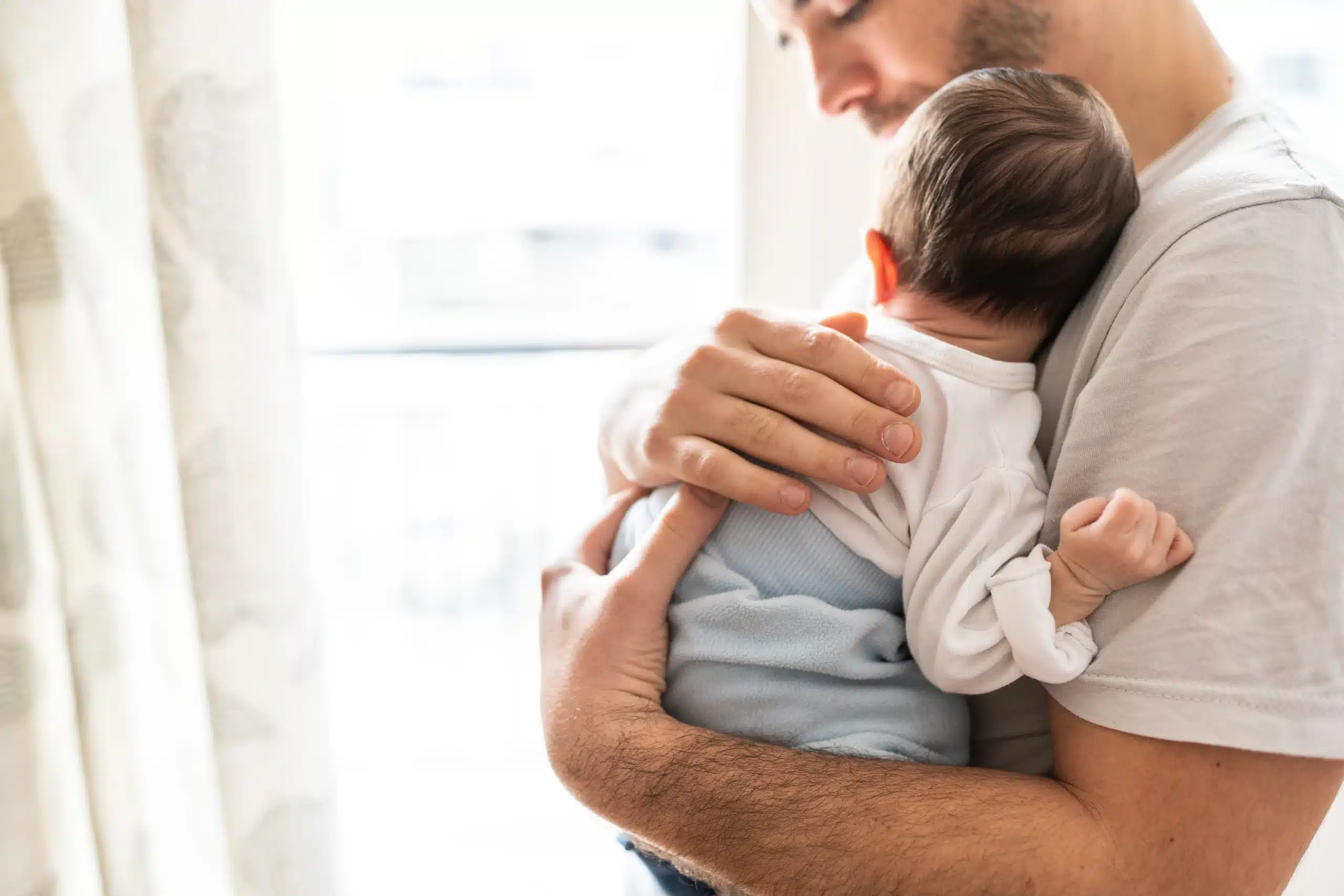 dad holding baby