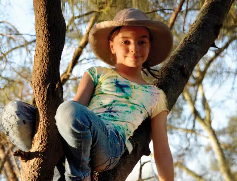 Floriane climbing in tree