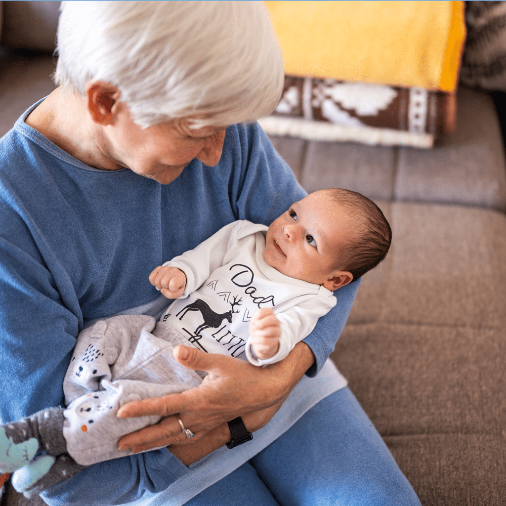 Older woman holding a baby