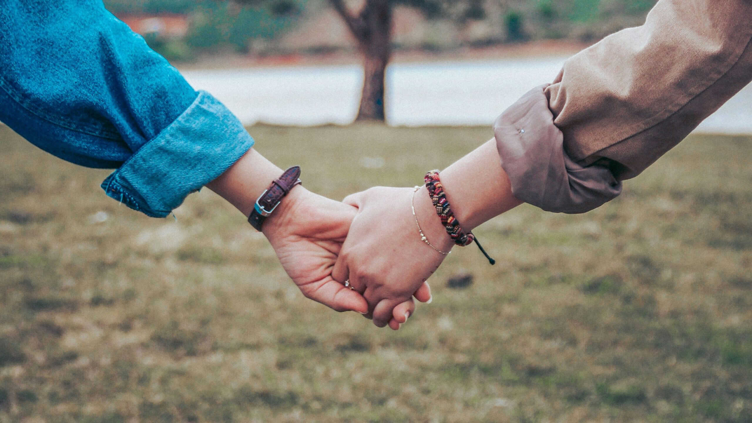 two people holding hands at a bereavement support group in melbourne