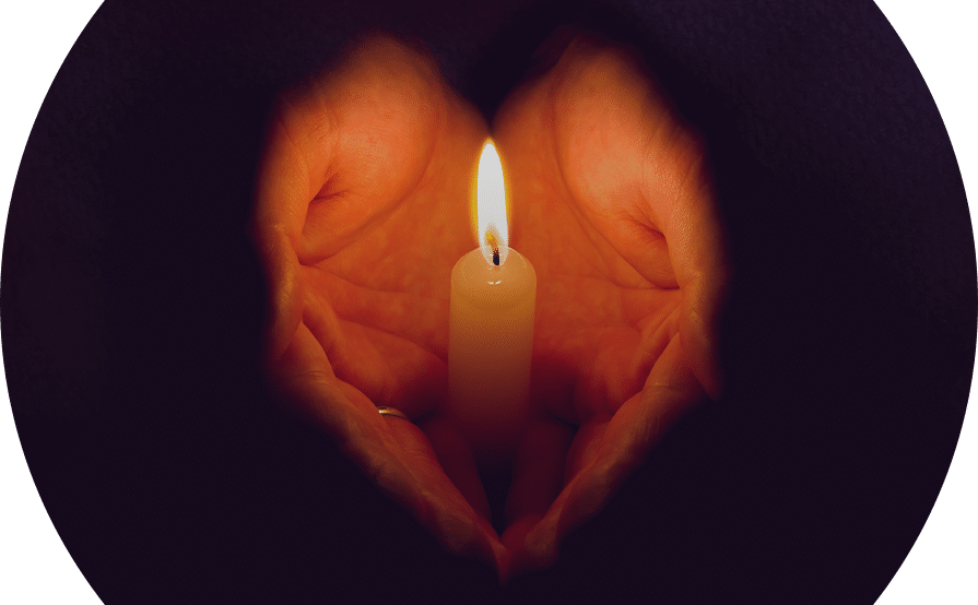 Hands holding a candle in celebration of PAIL